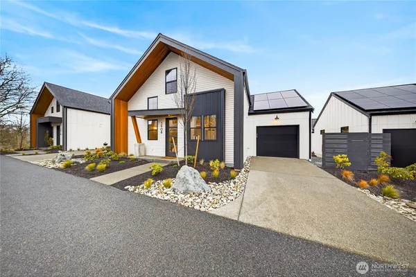 a front view of house with yard outdoor seating and barbeque oven