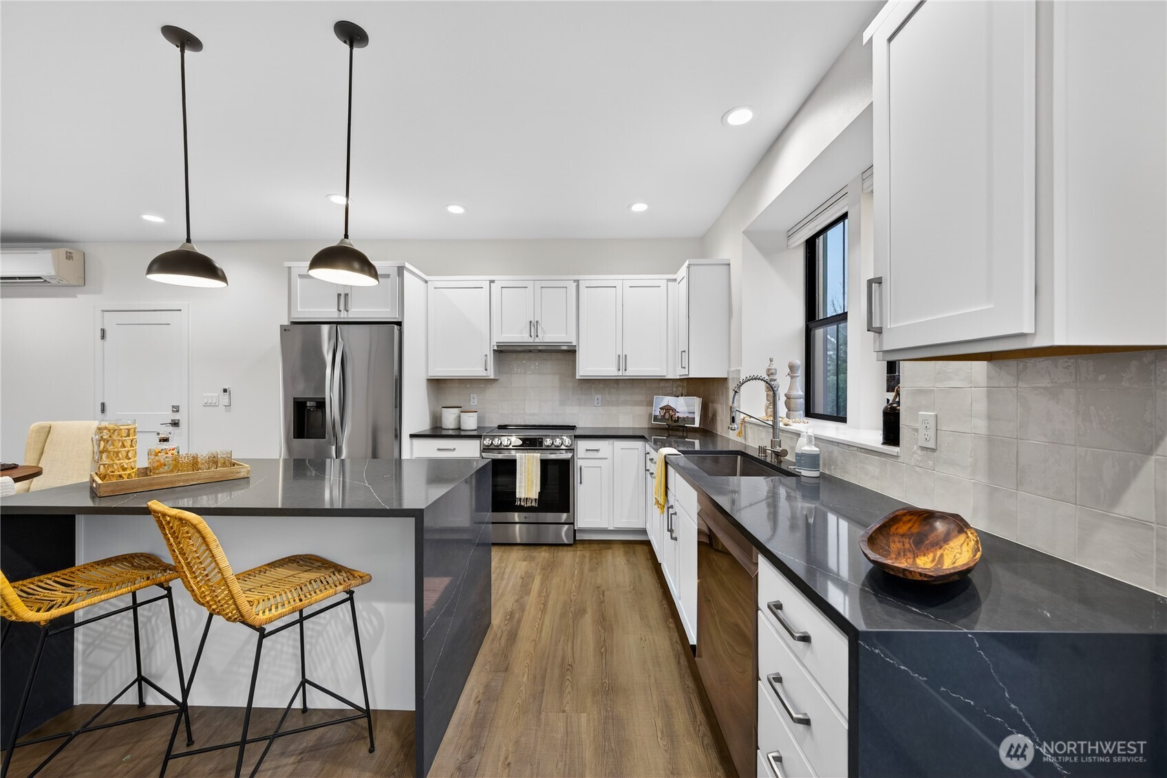 3908 Crosswinds Court Anacortes, WA 98221 - Photo 11 of 34 a kitchen with a sink a counter top space appliances and cabinets