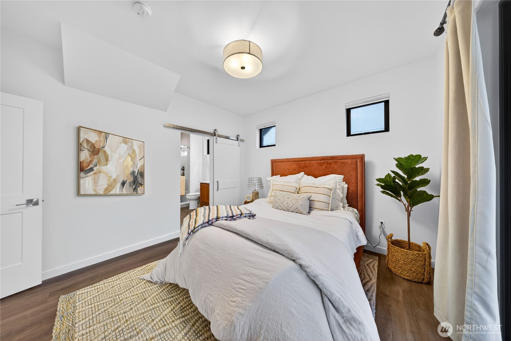 3908 Crosswinds Court Anacortes, WA 98221 - Photo 13 of 34 a bedroom with a bed and a painting on the wall