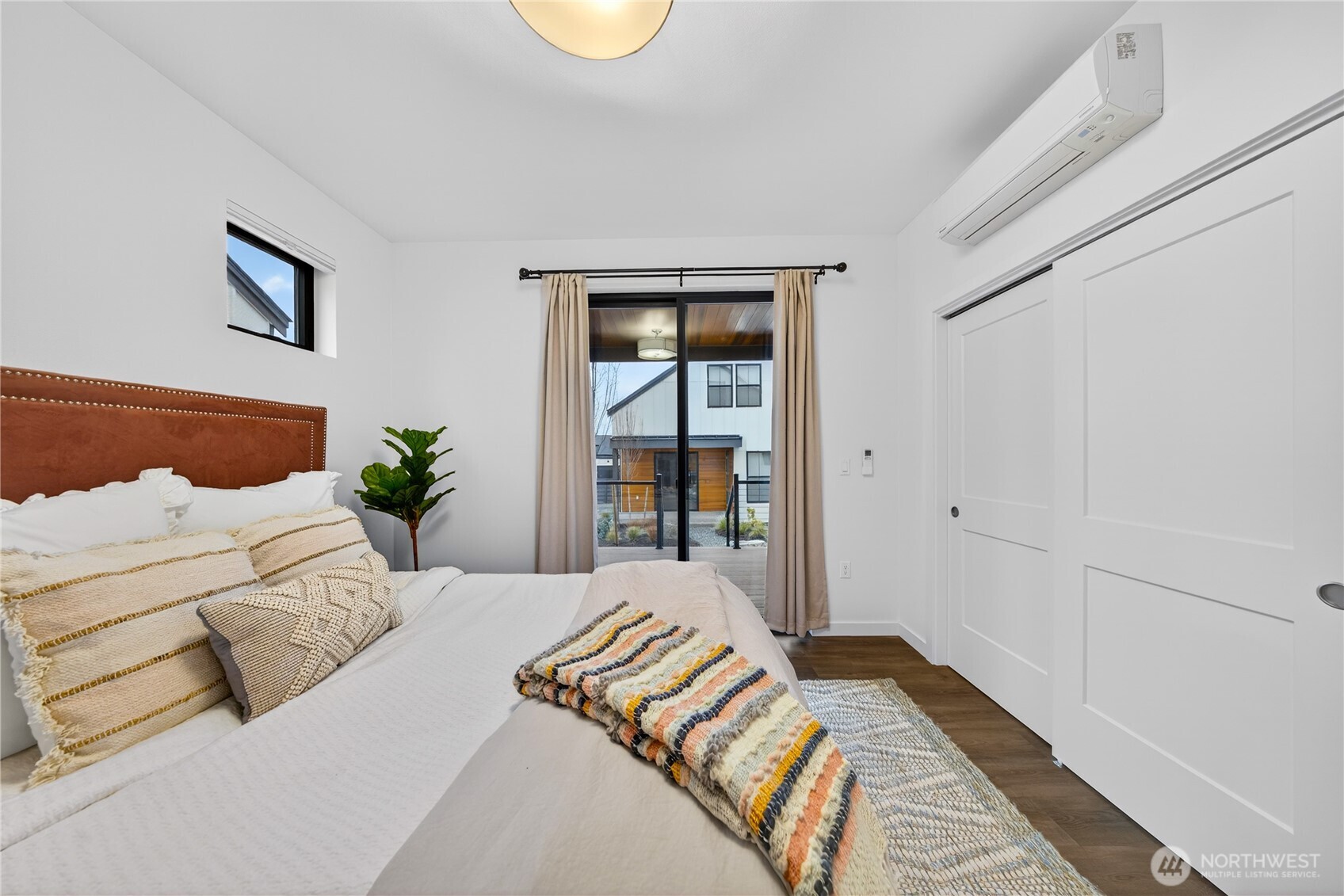 3908 Crosswinds Court Anacortes, WA 98221 - Photo 14 of 34 a bedroom with a large bed and a window