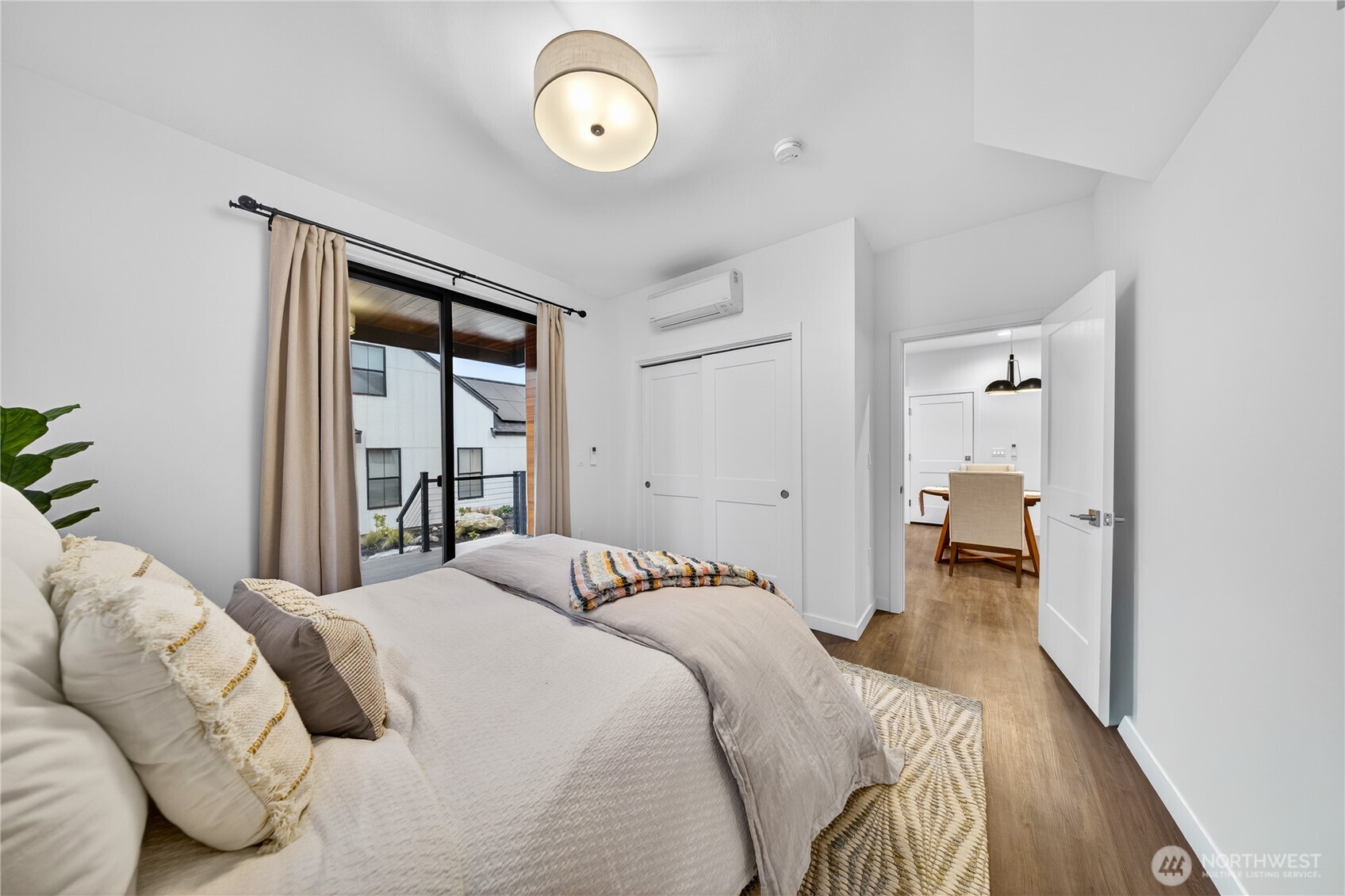 3908 Crosswinds Court Anacortes, WA 98221 - Photo 15 of 34 a bedroom with a large bed and a large window