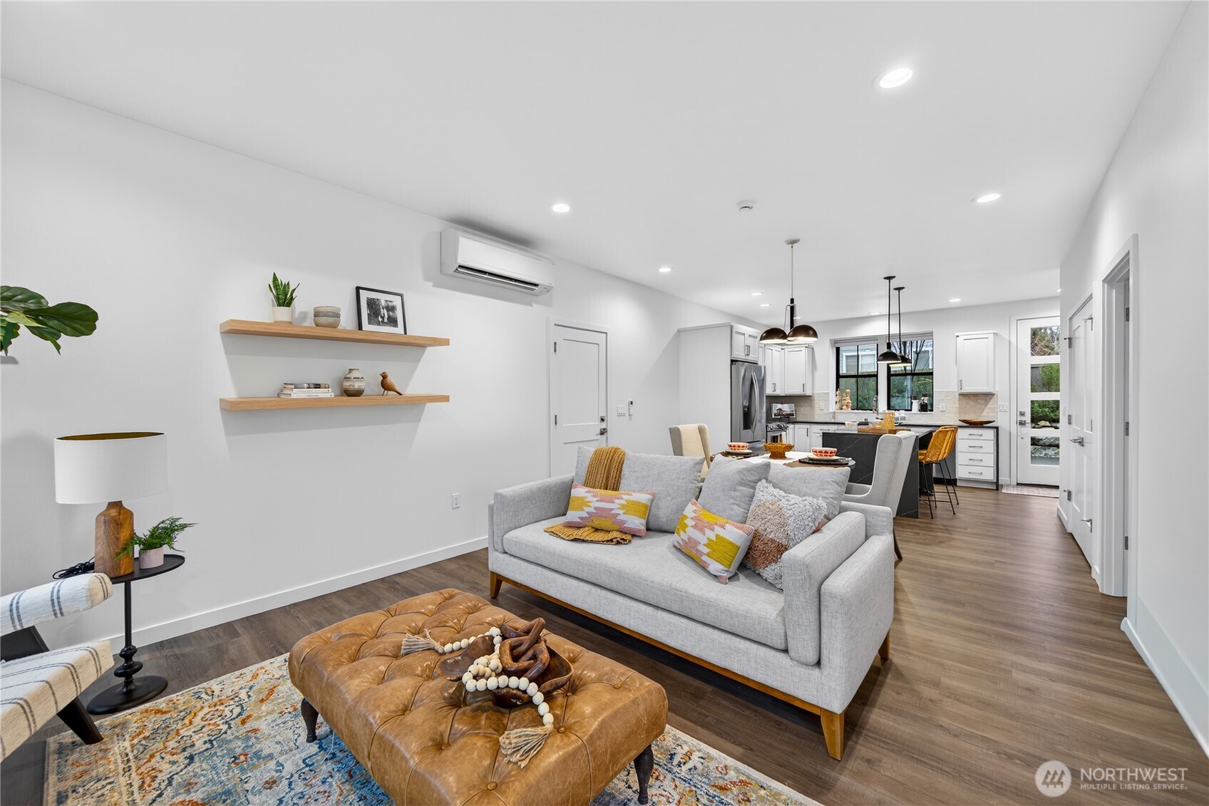 3908 Crosswinds Court Anacortes, WA 98221 - Photo 2 of 34 a living room with furniture and a wooden floor
