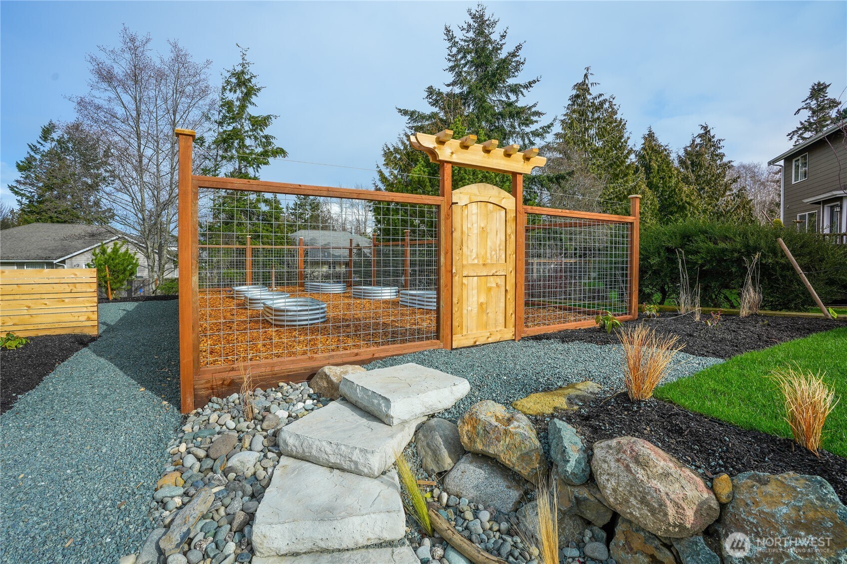 3908 Crosswinds Court Anacortes, WA 98221 - Photo 33 of 34 a backyard of a house with seating space