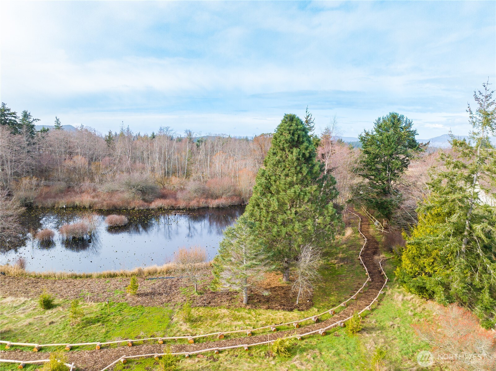 3908 Crosswinds Court Anacortes, WA 98221 - Photo 34 of 34 a view of a lake from a yard