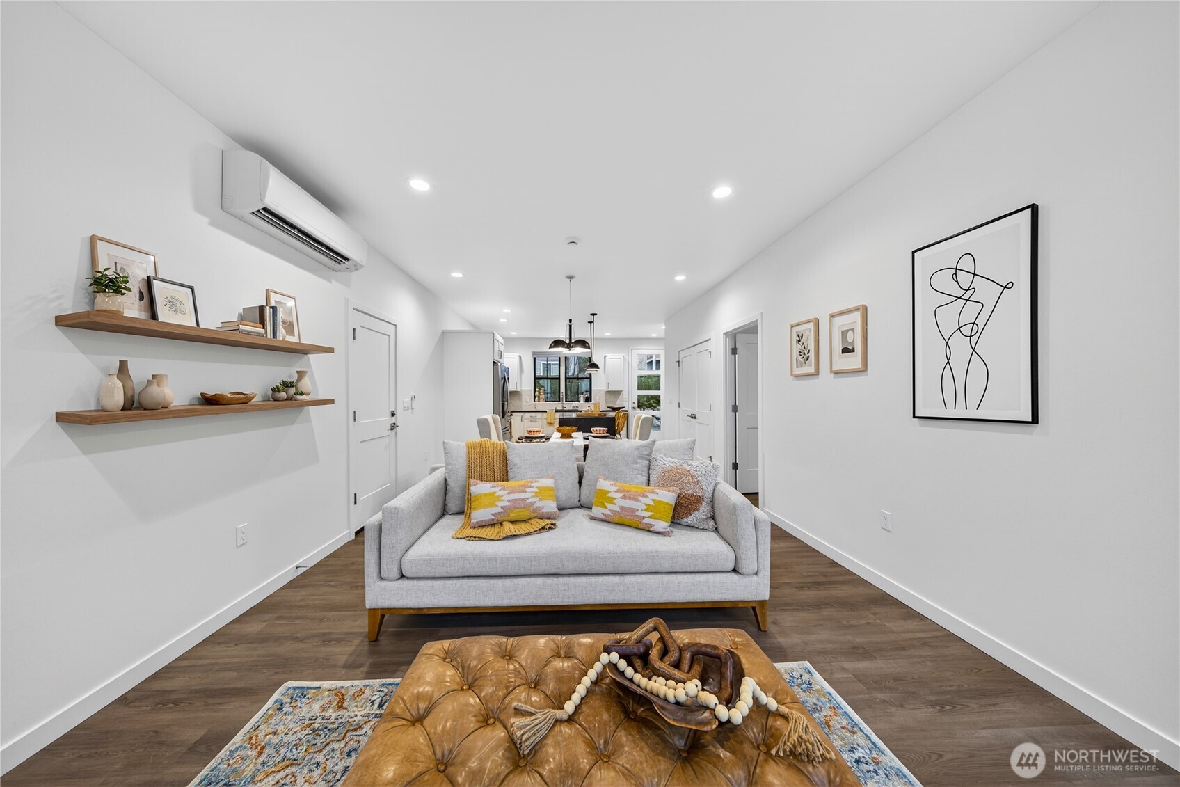 3908 Crosswinds Court Anacortes, WA 98221 - Photo 4 of 34 a living room with furniture and a wooden floor