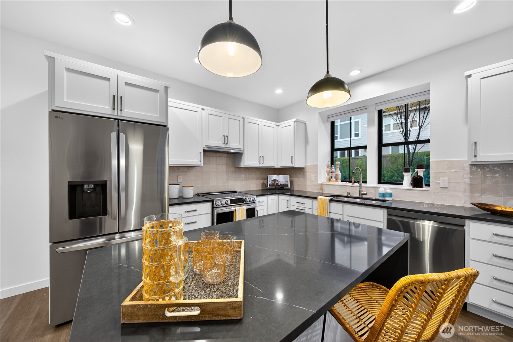 3908 Crosswinds Court Anacortes, WA 98221 - Photo 9 of 34 a kitchen with stainless steel appliances granite countertop a sink a stove and refrigerator