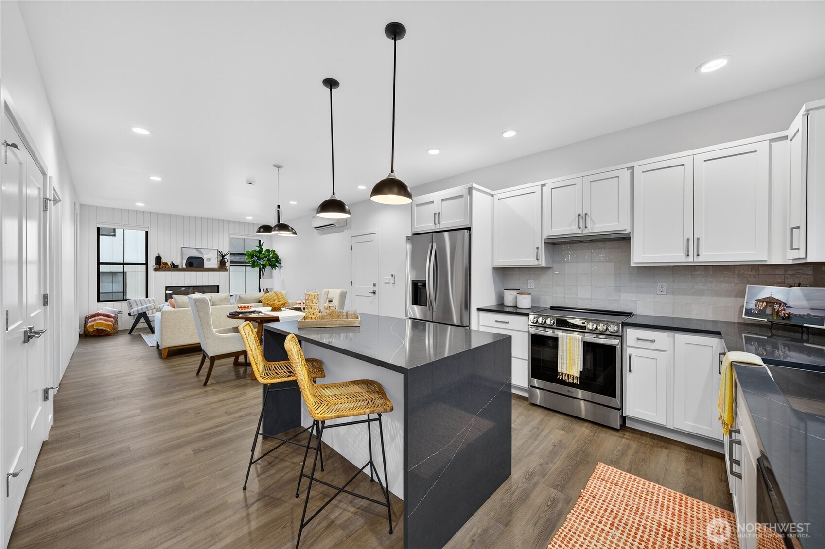 3908 Crosswinds Court Anacortes, WA 98221 - Photo 10 of 34 a view of kitchen with stainless steel appliances granite countertop cabinets and wooden floor