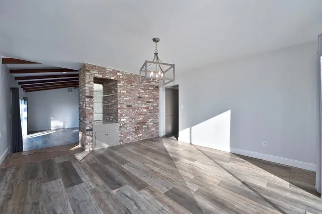 a kitchen with appliances a sink and cabinets