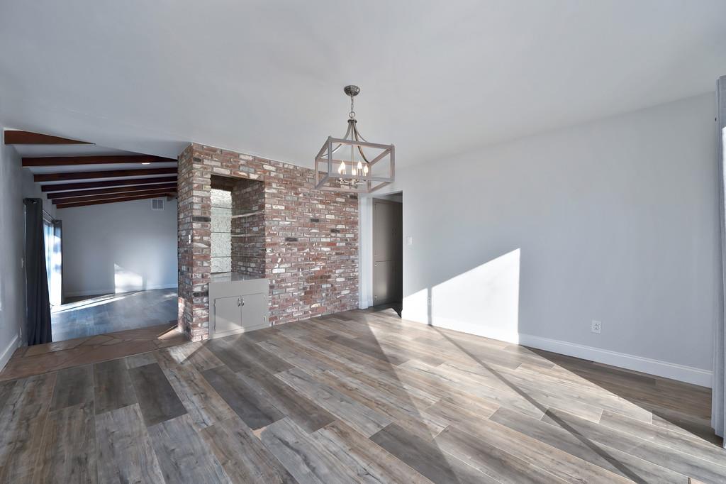 2298 Pinon Road Rescue, CA 95672 - Photo 14 of 67 a view of empty room with wooden floor and fireplace