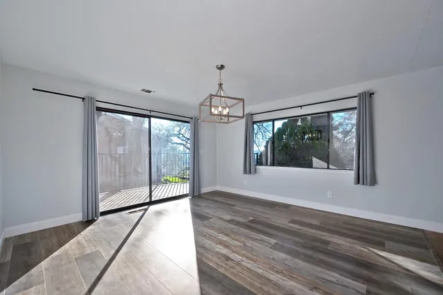 a kitchen with kitchen island a sink stainless steel appliances and cabinets
