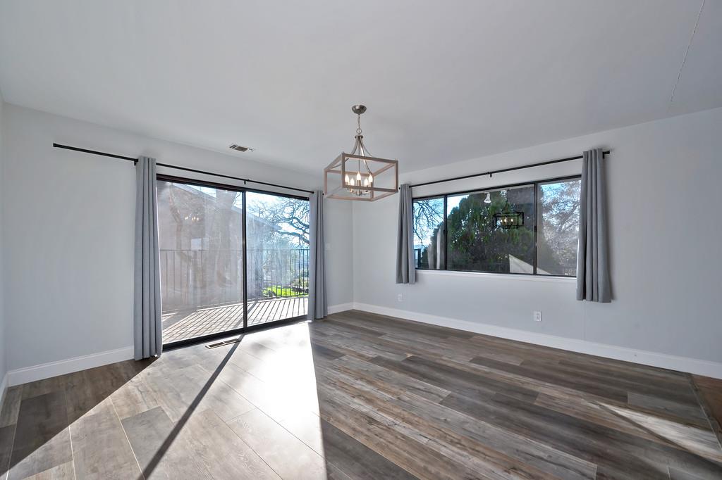 2298 Pinon Road Rescue, CA 95672 - Photo 15 of 67 a view of an empty room with wooden floor and a window