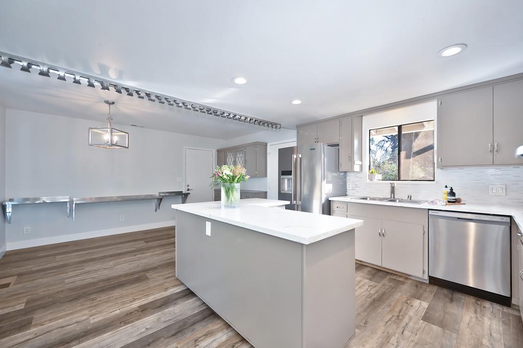 2298 Pinon Road Rescue, CA 95672 - Photo 17 of 67 a kitchen with granite countertop a sink and cabinets