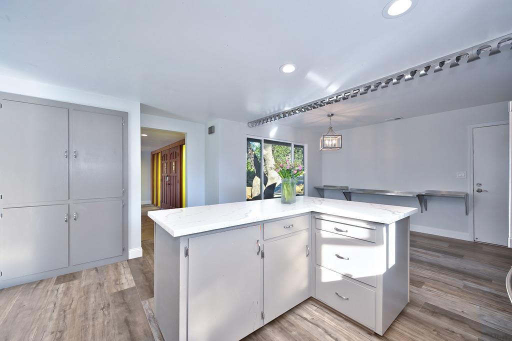 2298 Pinon Road Rescue, CA 95672 - Photo 18 of 67 a kitchen with a sink cabinets and wooden floor