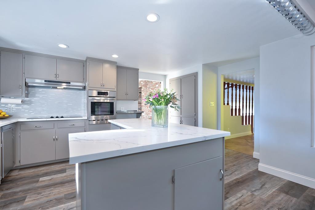 2298 Pinon Road Rescue, CA 95672 - Photo 20 of 67 a kitchen with kitchen island a sink stainless steel appliances and cabinets
