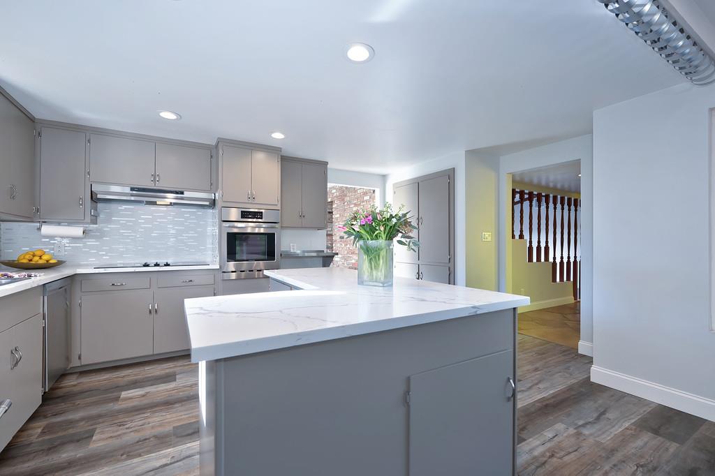 2298 Pinon Road Rescue, CA 95672 - Photo 21 of 67 a kitchen with kitchen island a sink stainless steel appliances and cabinets