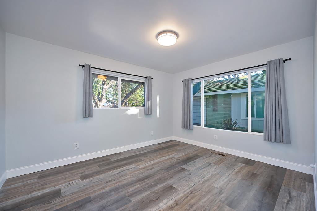 2298 Pinon Road Rescue, CA 95672 - Photo 30 of 67 a view of an empty room with wooden floor and a window