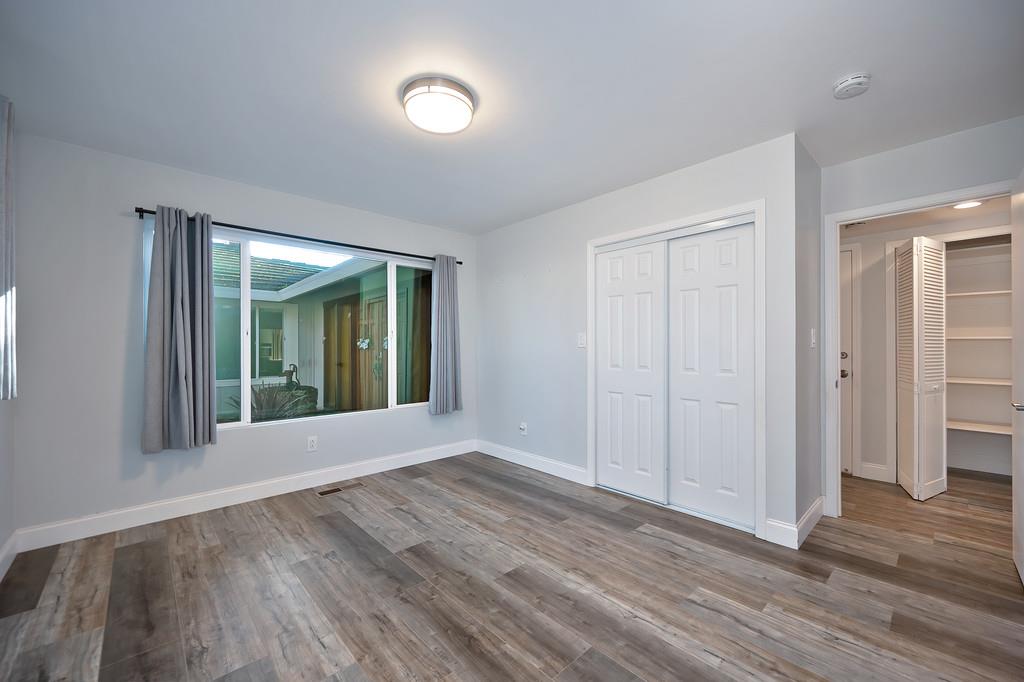 2298 Pinon Road Rescue, CA 95672 - Photo 31 of 67 a view of an empty room with wooden floor and a window