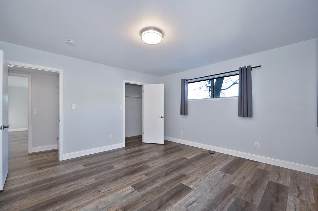 2298 Pinon Road Rescue, CA 95672 - Photo 33 of 67 a view of an empty room with wooden floor and a window
