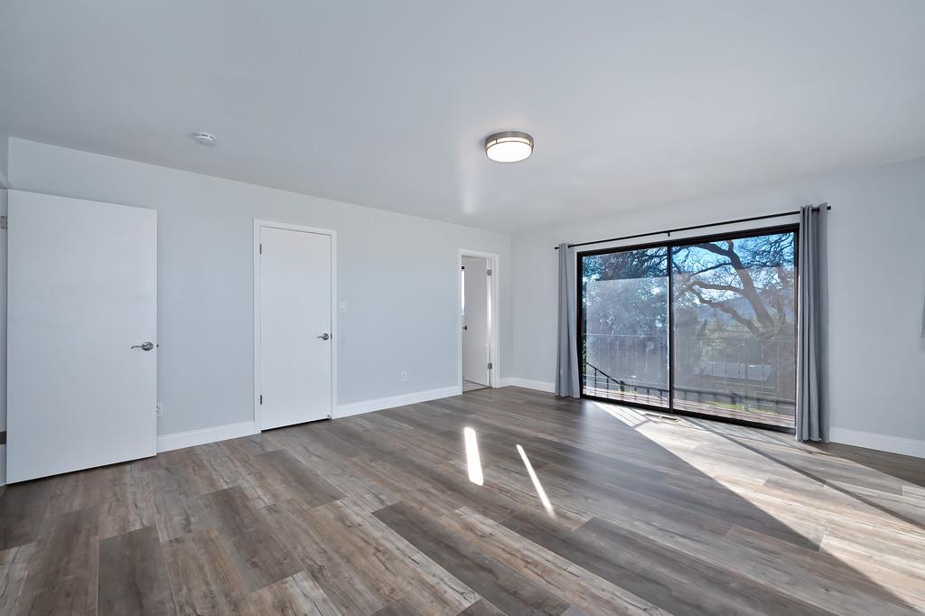 2298 Pinon Road Rescue, CA 95672 - Photo 35 of 67 a view of empty room with wooden floor and fan