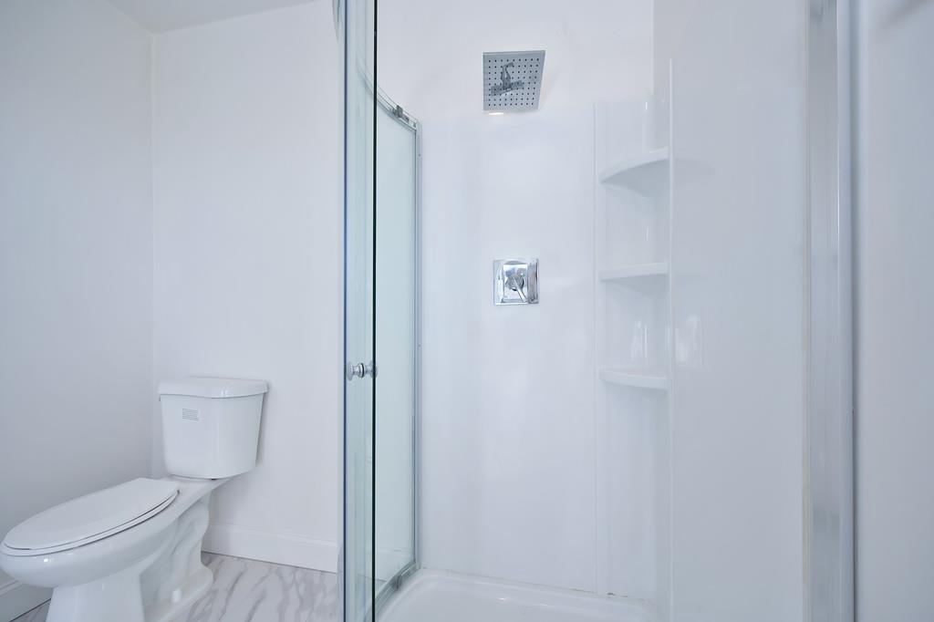 2298 Pinon Road Rescue, CA 95672 - Photo 39 of 67 a bathroom with a toilet and a shower