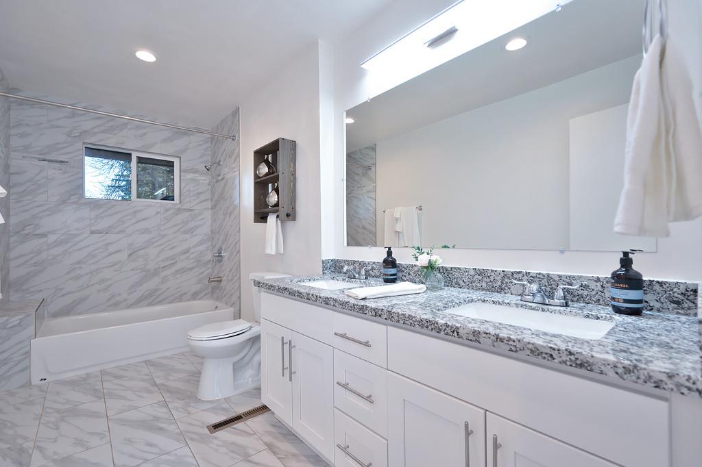 2298 Pinon Road Rescue, CA 95672 - Photo 41 of 67 a bathroom with a granite countertop sink toilet and shower