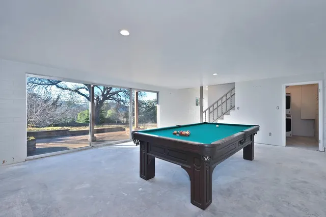 a view of balcony with wooden fence and floor