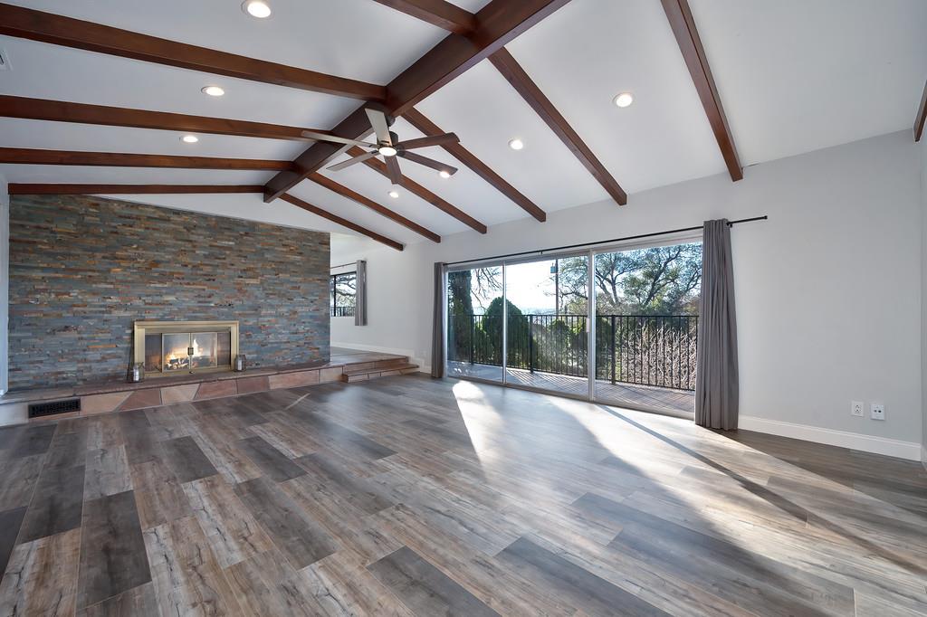 2298 Pinon Road Rescue, CA 95672 - Photo 10 of 67 a view of empty room with wooden floor and fireplace