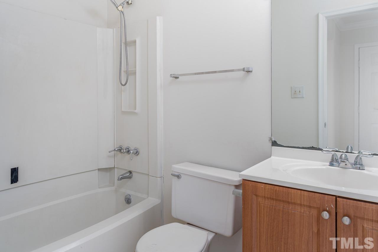 3120 Quinley Place Raleigh, NC 27604 - Photo 14 of 18 a bathroom with a sink a toilet and shower