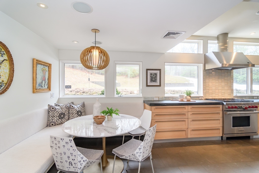 41 Grove Street Wayland, MA 01778 - Photo 7 of 24 a kitchen with a table and chairs