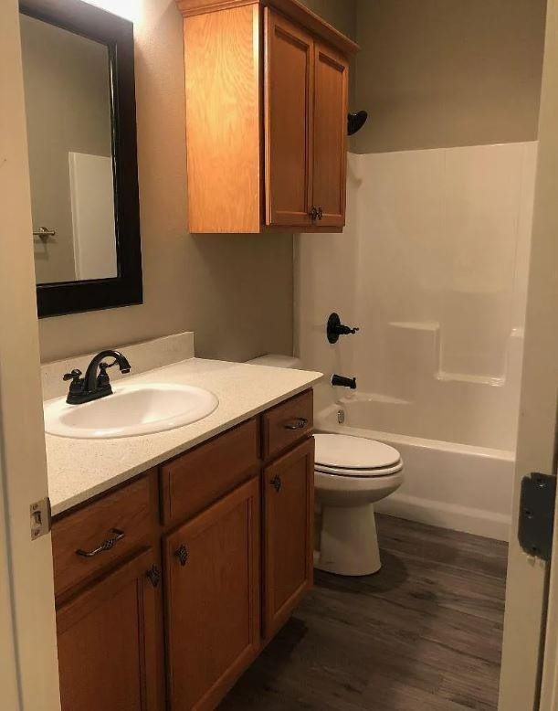 1203 Preston Trail, Unit B Wolfforth, TX 79382 - Photo 9 of 13 a bathroom with a sink and a mirror