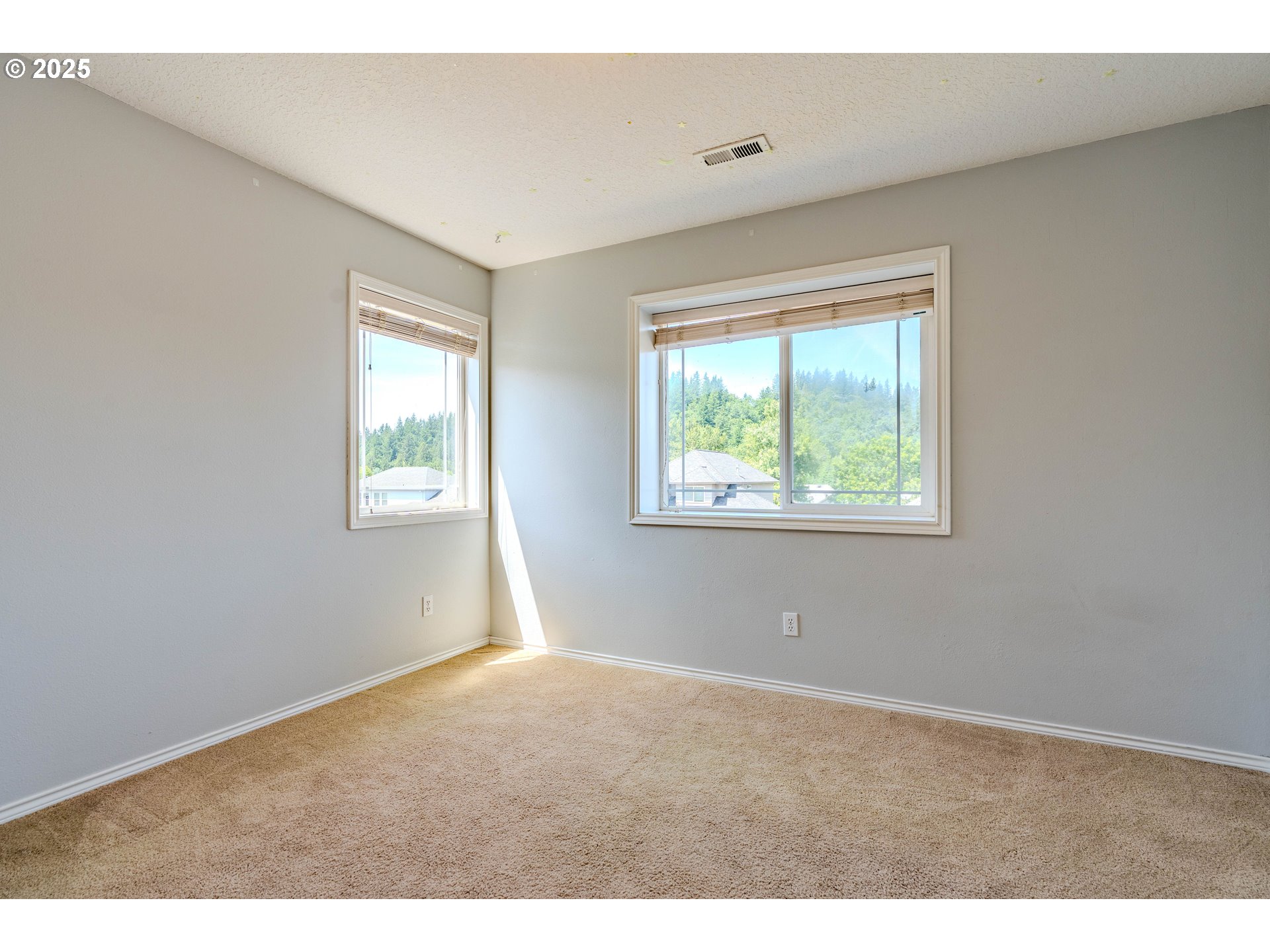 308 Southwest 38th Loop Gresham, OR 97080 - Photo 34 of 48 a view of an empty room with a window
