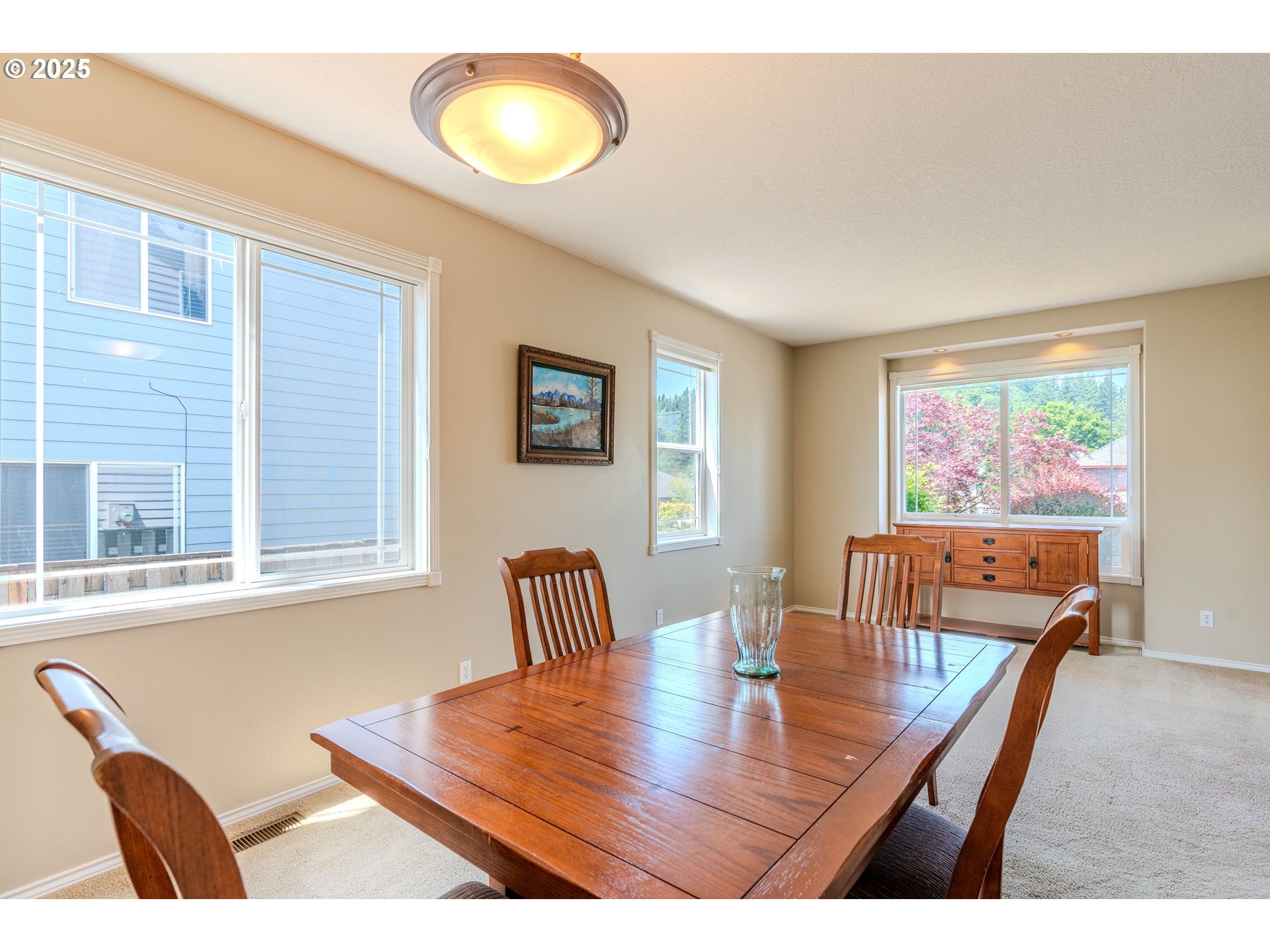 308 Southwest 38th Loop Gresham, OR 97080 - Photo 8 of 48 a view of a dining room with furniture and wooden floor