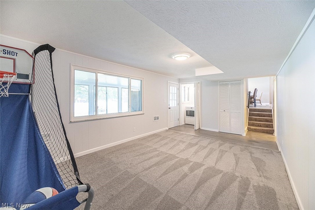 1275 Long Ridge Drive Independence, OH 44131 - Photo 11 of 31 Lower Level Family Room features newer carpeting and has access to Laundry nook and Sunroom