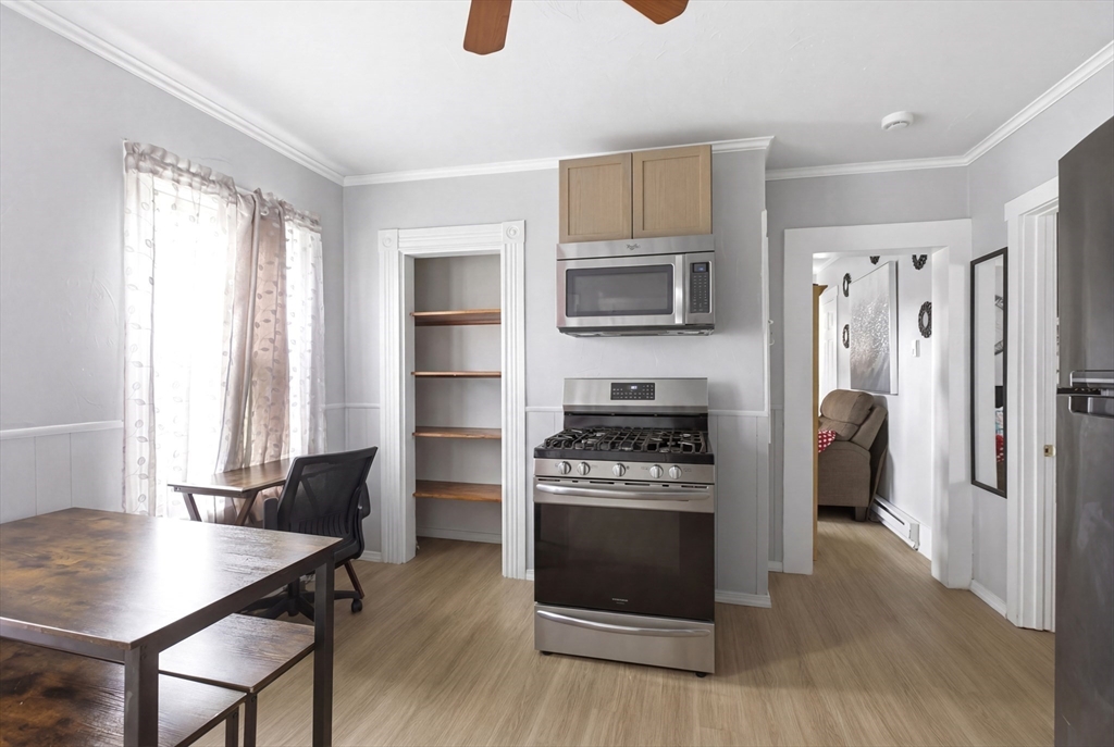 81 Ward Street Worcester, MA 01610 - Photo 1 of 34 a kitchen with stainless steel appliances a stove a microwave and a refrigerator