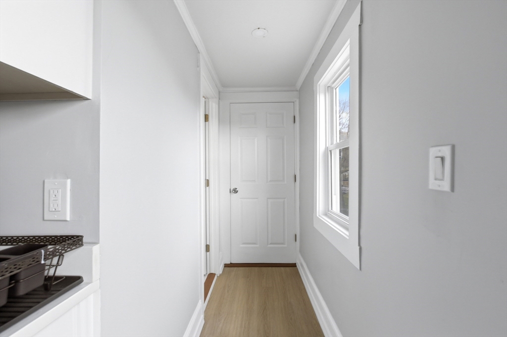 81 Ward Street Worcester, MA 01610 - Photo 12 of 34 a view of a kitchen from the hallway