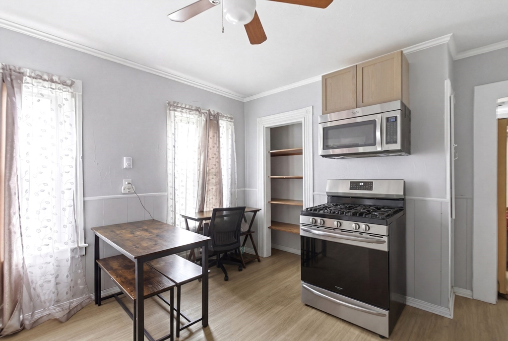 81 Ward Street Worcester, MA 01610 - Photo 2 of 34 a kitchen with stainless steel appliances a stove a microwave and cabinets
