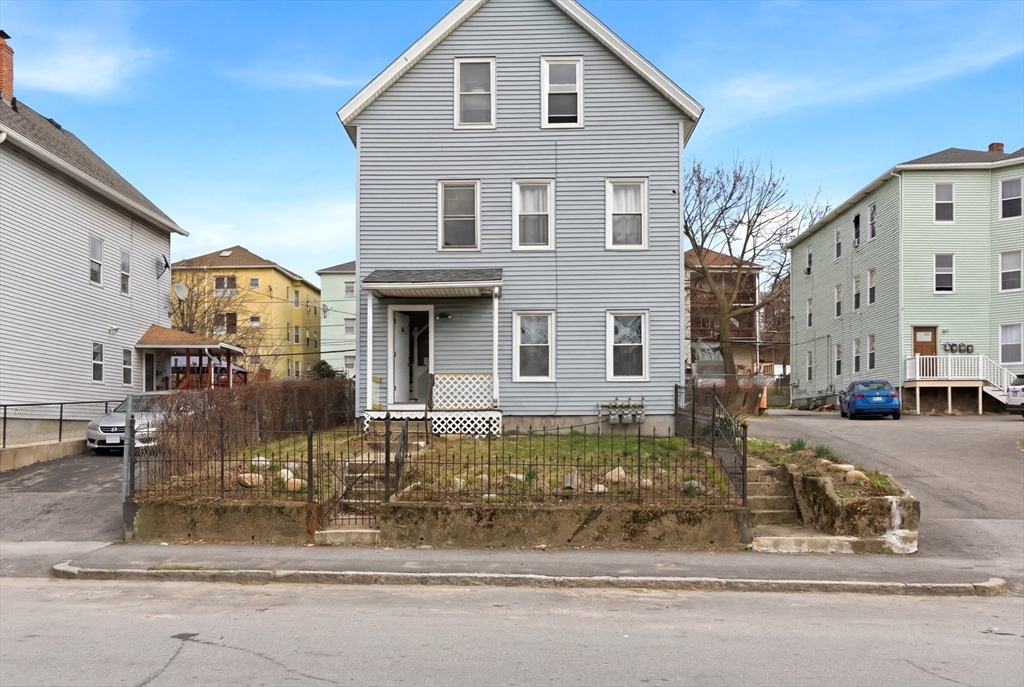 81 Ward Street Worcester, MA 01610 - Photo 23 of 34 a front view of a house with a yard