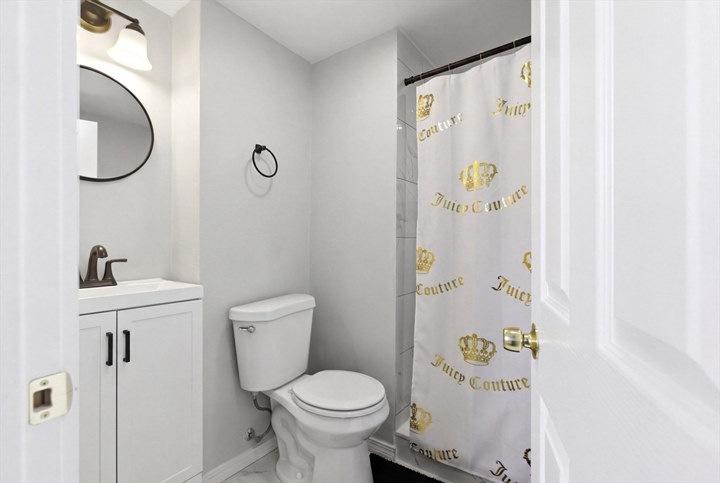 81 Ward Street Worcester, MA 01610 - Photo 6 of 34 a bathroom with a sink toilet and shower