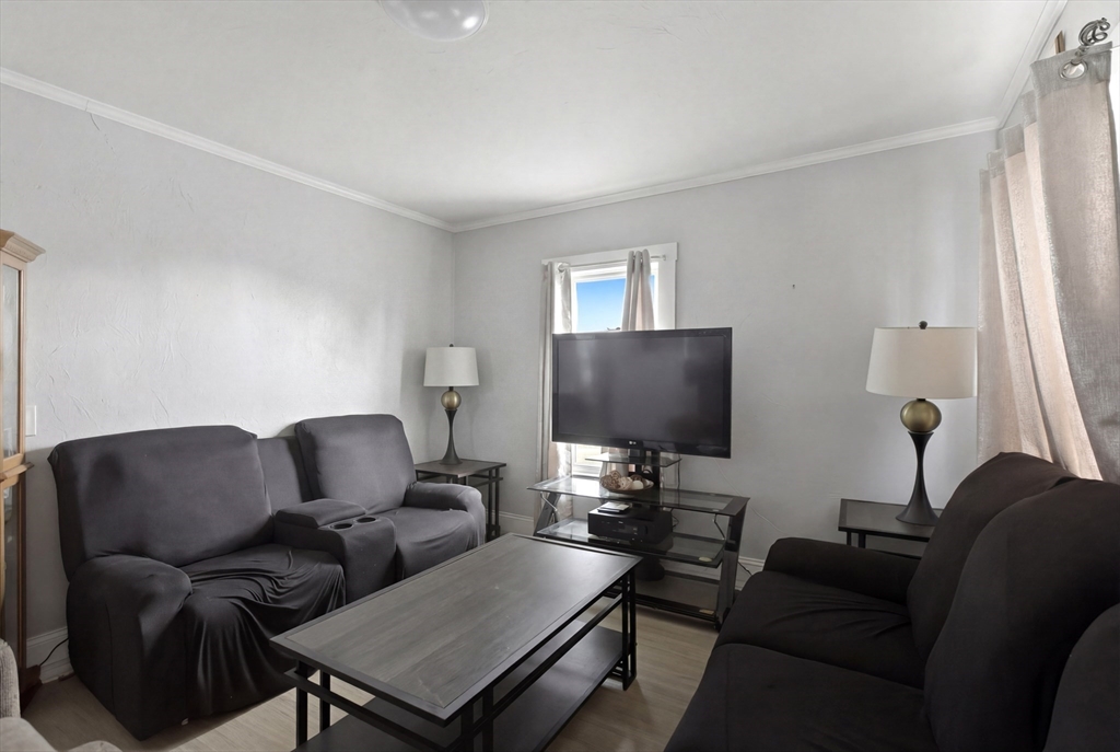 81 Ward Street Worcester, MA 01610 - Photo 7 of 34 a living room with furniture and a flat screen tv
