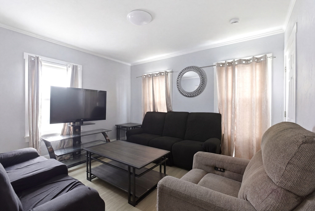81 Ward Street Worcester, MA 01610 - Photo 8 of 34 a living room with furniture and a flat screen tv