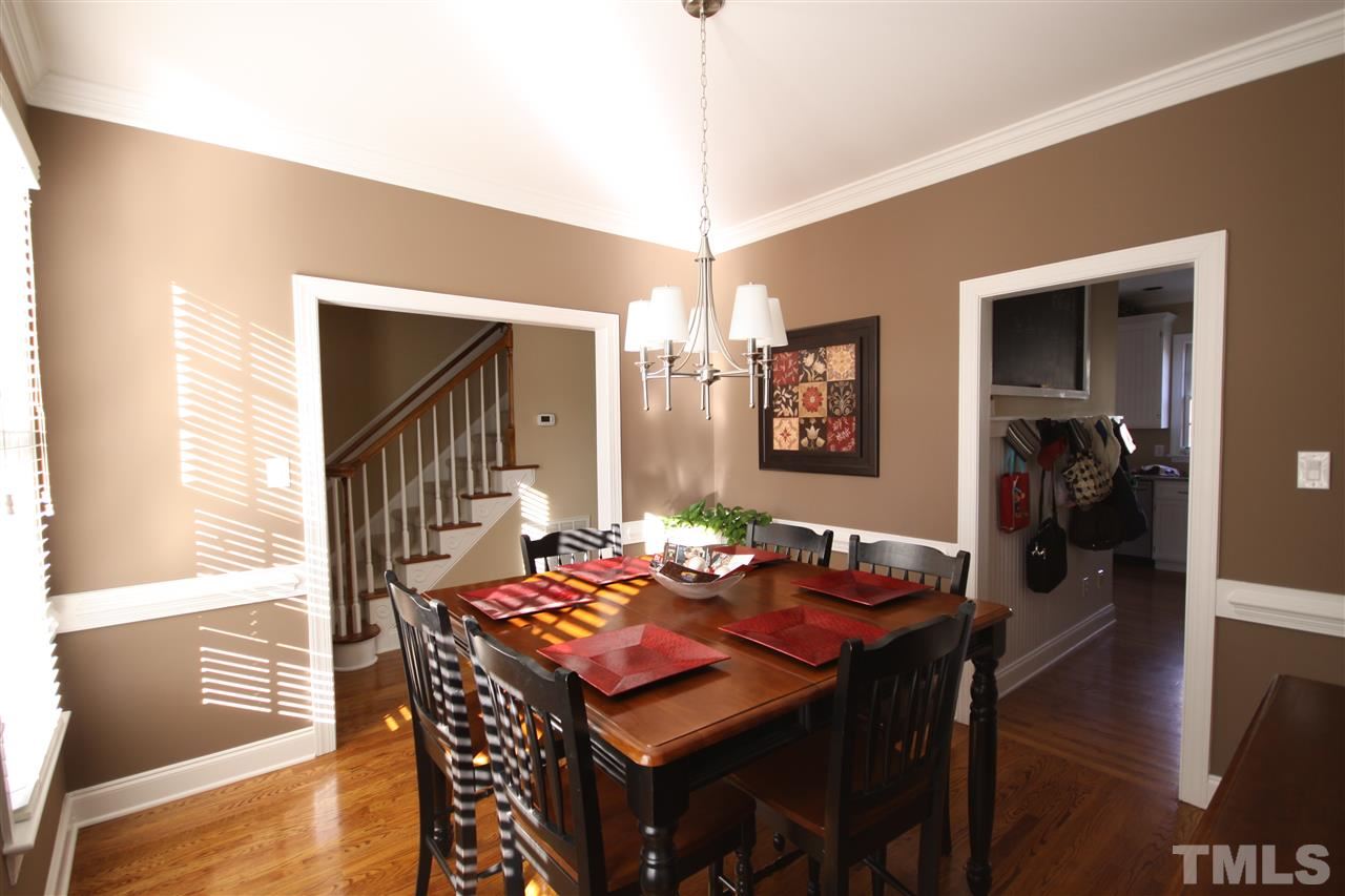10001 Kilnstone Lane Raleigh, NC 27613 - Photo 2 of 9 a view of a dining room with furniture and wooden floor