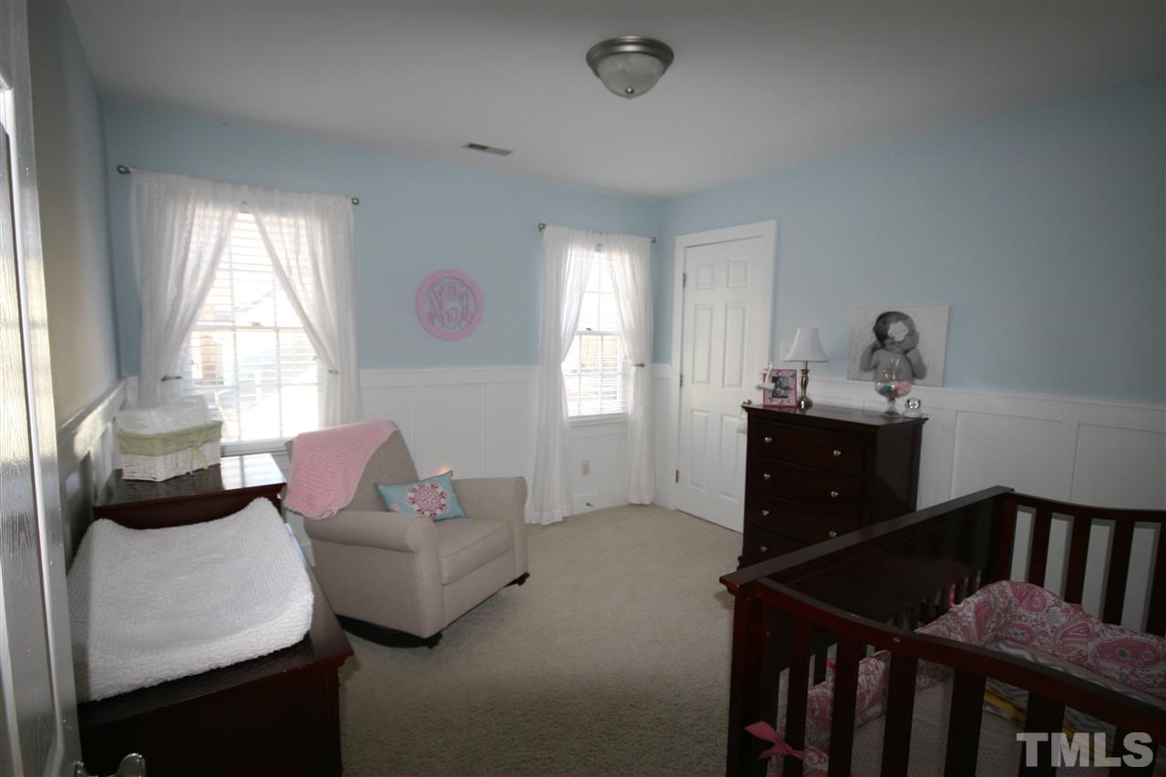 10001 Kilnstone Lane Raleigh, NC 27613 - Photo 6 of 9 a living room with furniture and a window