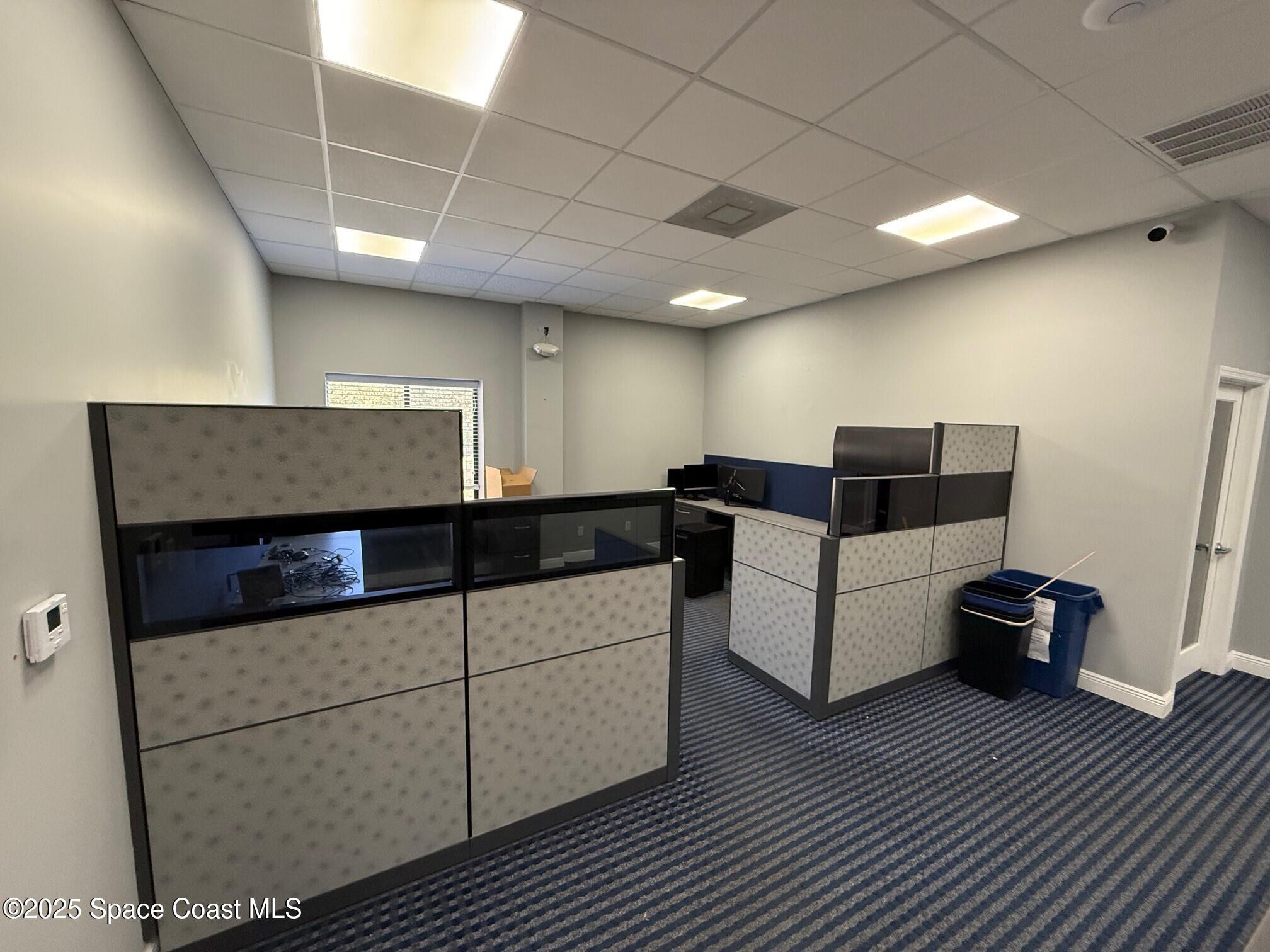 5121 Industry Drive, Unit 103105 Melbourne, FL 32940 - Photo 4 of 13 a living room with furniture