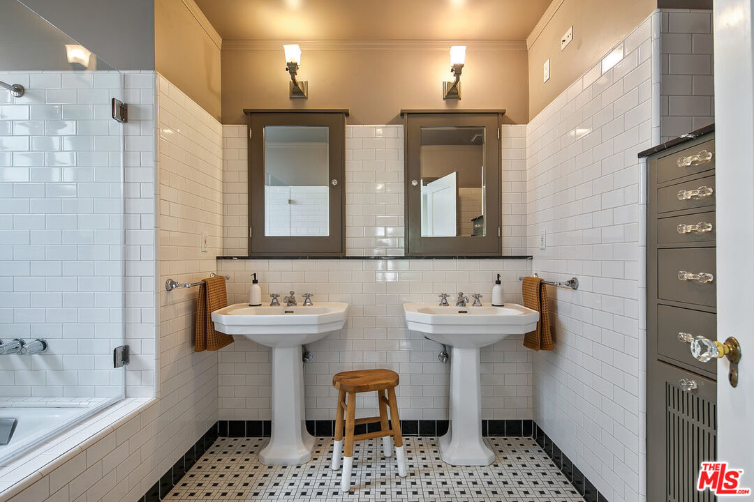 232 North Windsor Boulevard Los Angeles, CA 90004 - Photo 11 of 20 a bathroom with a sink and a mirror