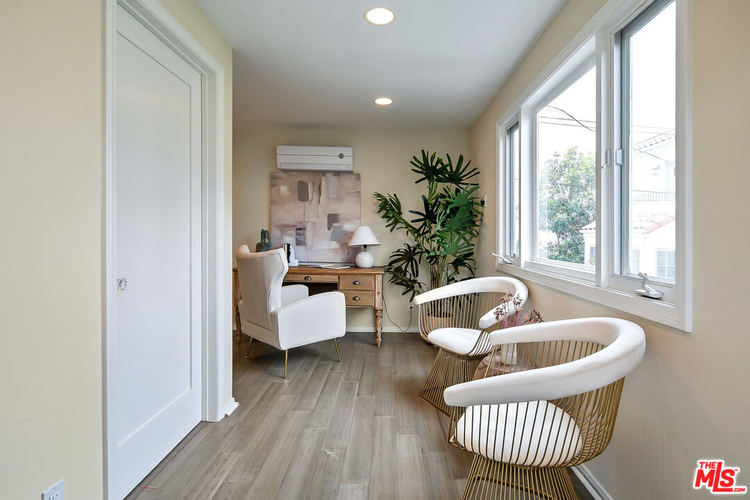 232 North Windsor Boulevard Los Angeles, CA 90004 - Photo 16 of 20 a living room with furniture and a window