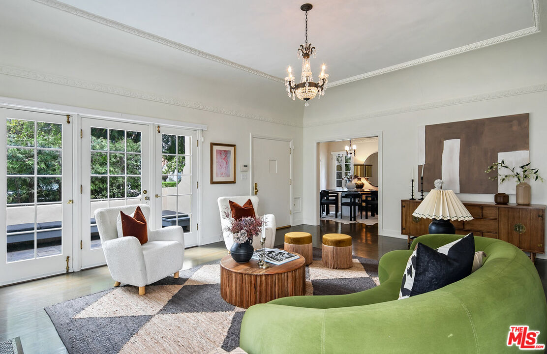 232 North Windsor Boulevard Los Angeles, CA 90004 - Photo 3 of 20 a living room with furniture and a chandelier