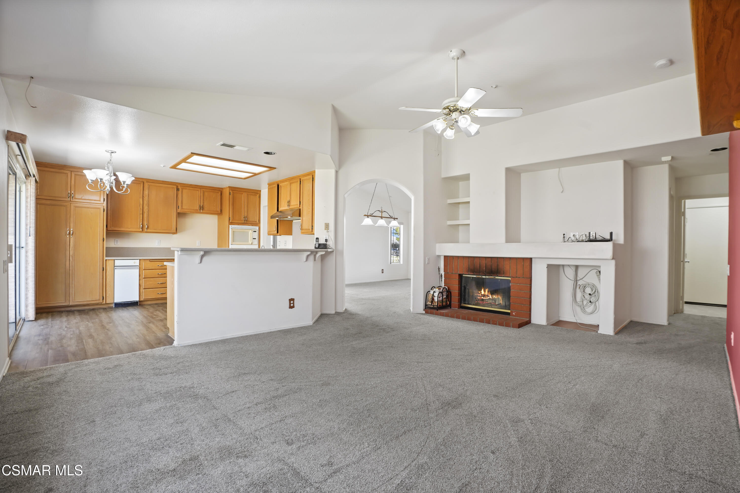 663 Novato Drive Oxnard, CA 93035 - Photo 12 of 40 a view of a kitchen with a sink and a fireplace