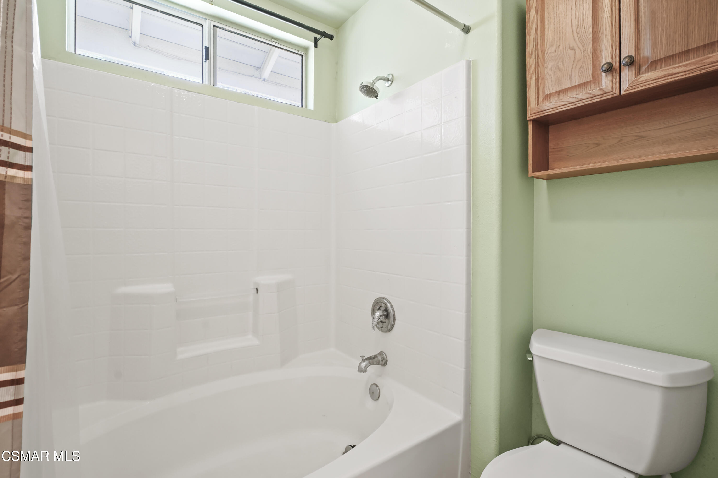 663 Novato Drive Oxnard, CA 93035 - Photo 20 of 40 a white bath tub sitting next to a toilet