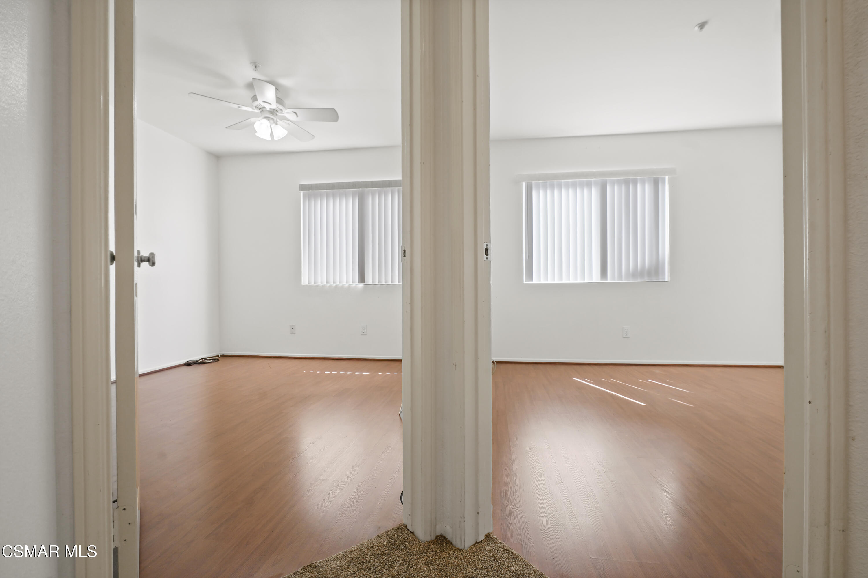 663 Novato Drive Oxnard, CA 93035 - Photo 28 of 40 a view of an empty room with wooden floor and a window