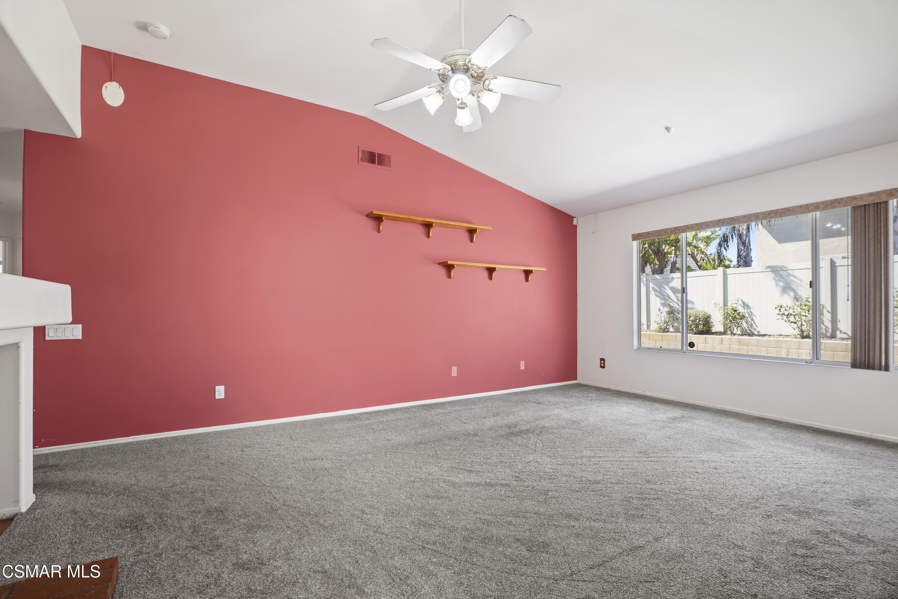 663 Novato Drive Oxnard, CA 93035 - Photo 9 of 40 a view of an empty room with window and chandelier fan